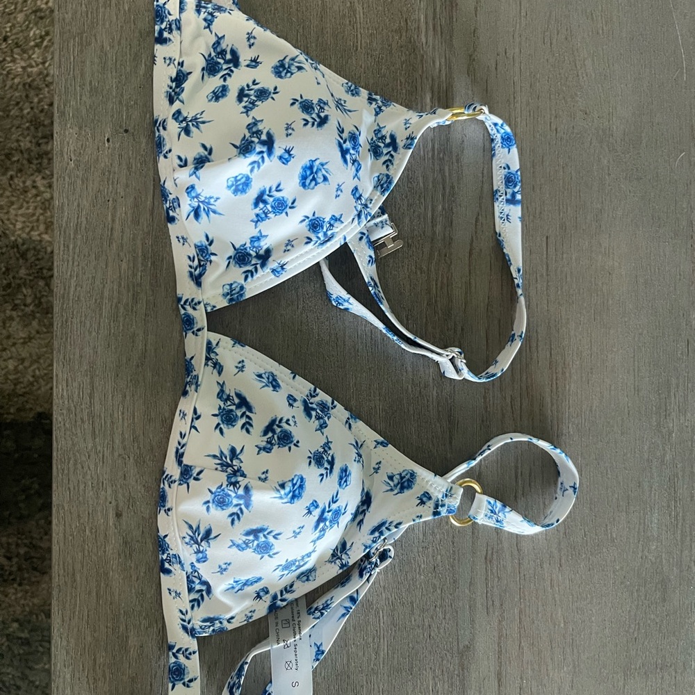 White bathing suit top with blue floral